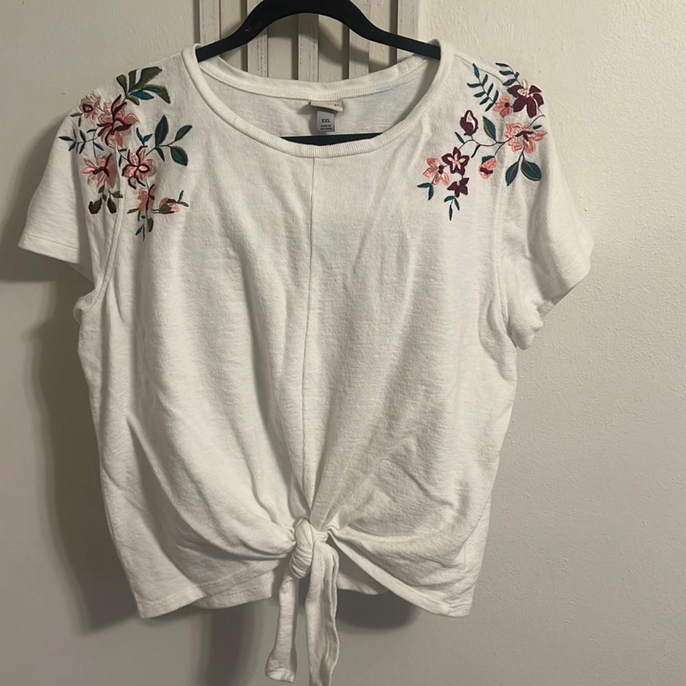 A New Day size XLwaist length tee with with embroidered sleeves.